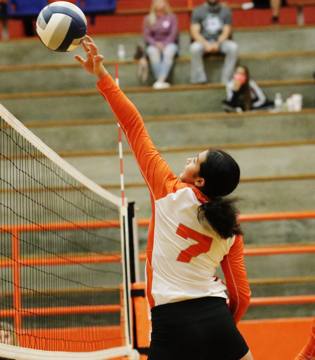 Lady Jacket Valerie Garcia makes a play at the net. (Monitor photo by John Arbter)